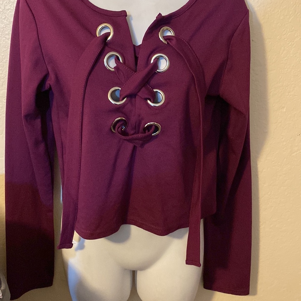 Rue 21 eggplant long sleeve top with large grommets lace up
